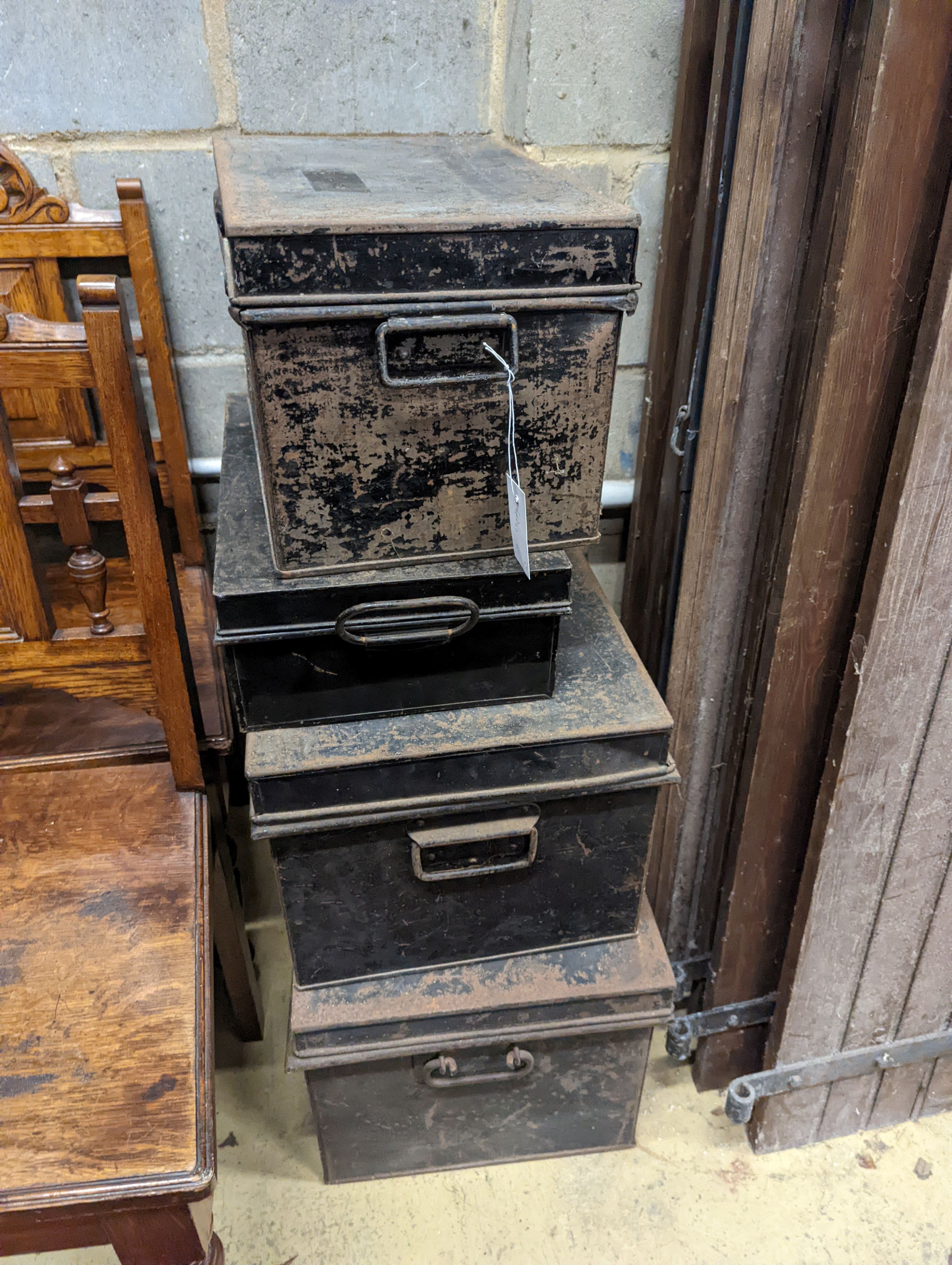 Four rectangular vintage tin trunks, largest width 52cm, depth 36cm